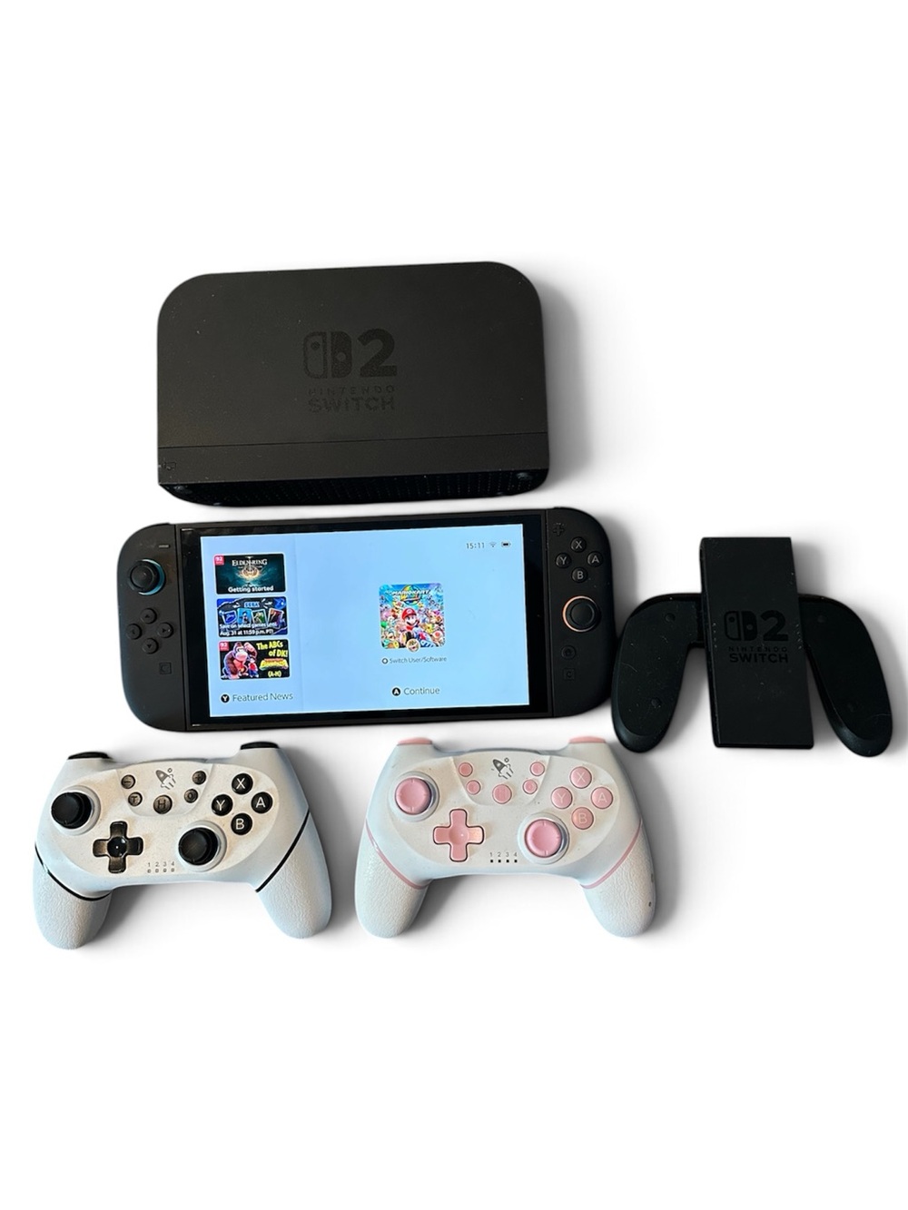 Nintendo Switch OLED Console with White and Pink Wireless Controllers